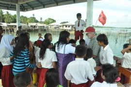 Meeting us at the village wharf